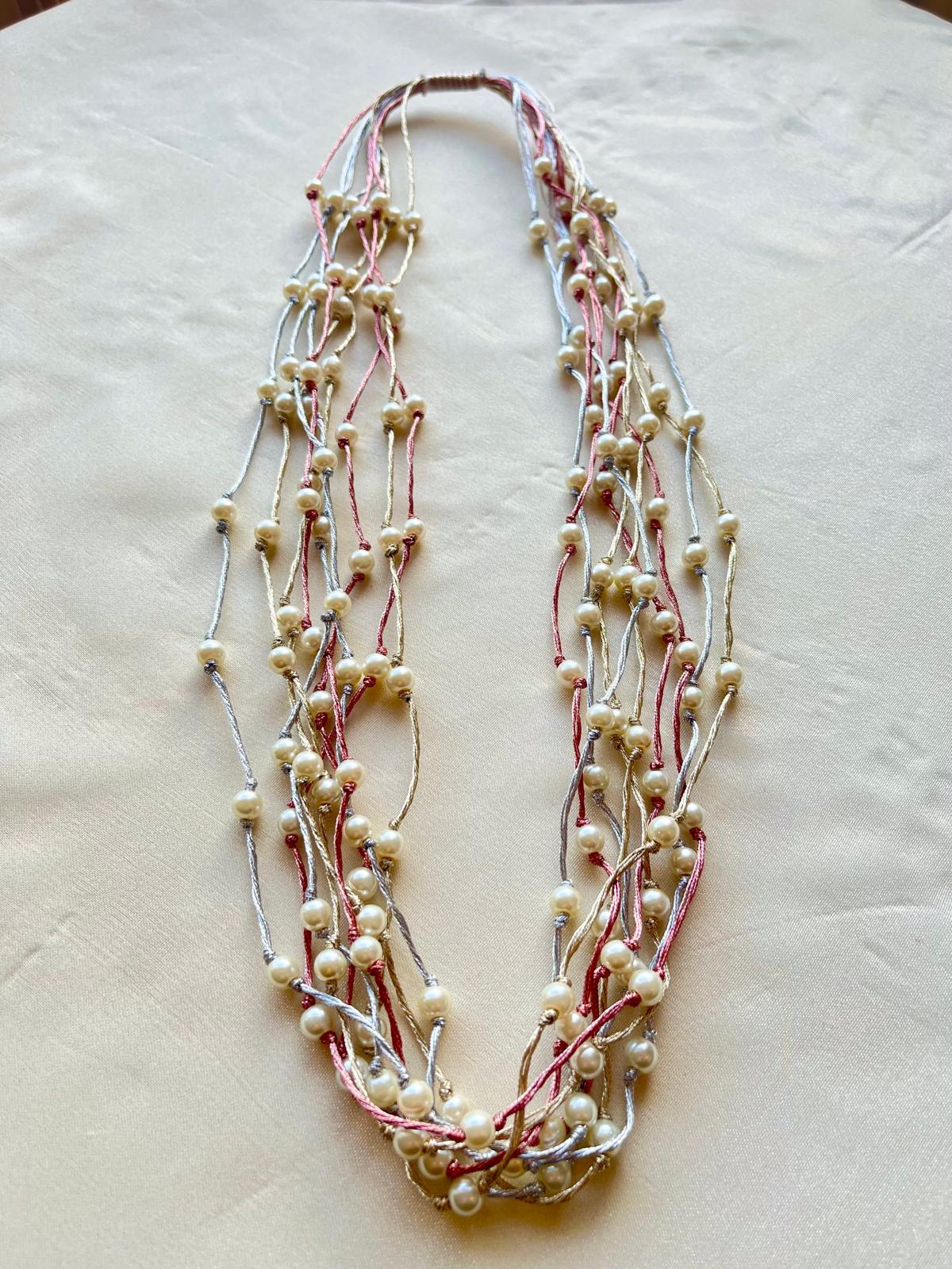 Pretty Necklace of White Pearls & Silver Gold & Rose Satin threads.hand knotted tightly.